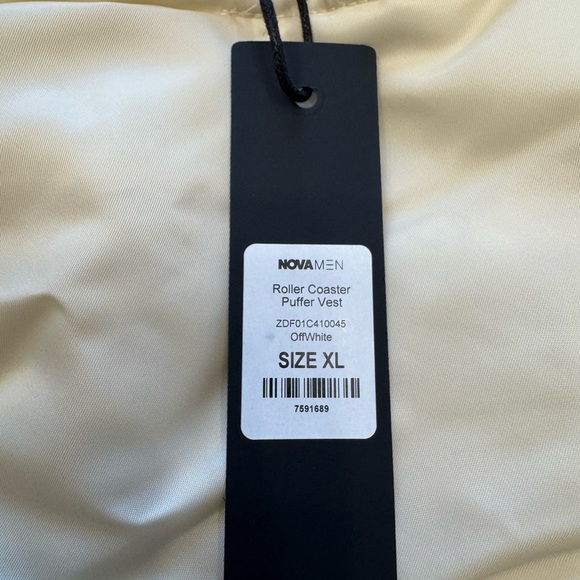 Roller Coaster Puffer Vest" in Off White from the brand Fashion Nova. - Picture 7 of 10